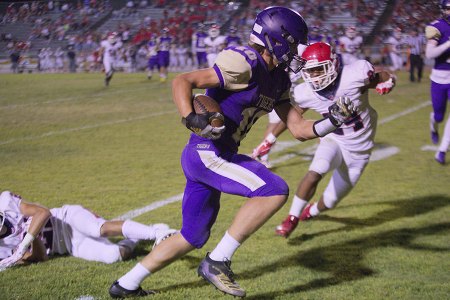 Lemoore's Koy Davis hauling in a pass from Holaday and taking the ball to the 10-yard-line in Friday night's loss to visiting Sanger.